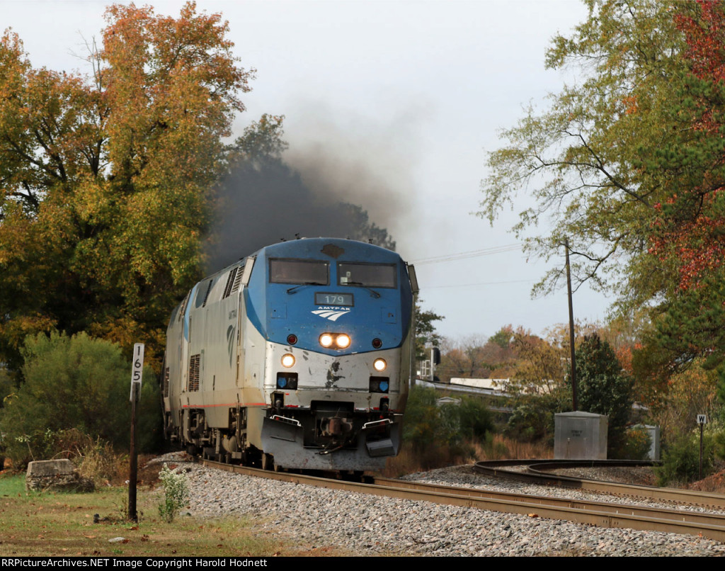 AMTK 179 leads train P092-05 away from the station